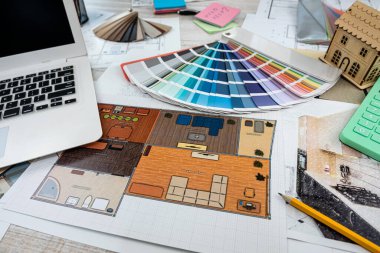 designers work as a team on drawings and designs of new house projects. Design and drawing concept