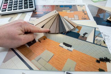 a young designer takes a project where you need to choose colors for a certain drawing of a new house. New building design concept