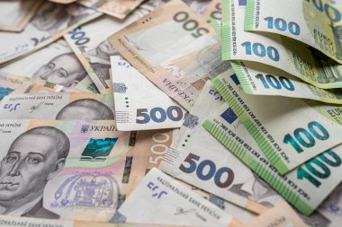 top view close up of a complete set of hryvnia and euro banknotes. Currency concept