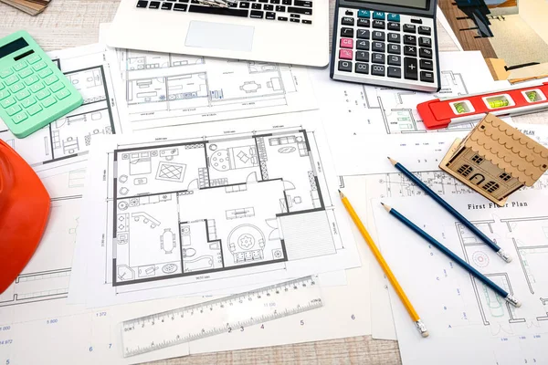 beautiful sketches of drawings for new houses scattered on the table. Design concept