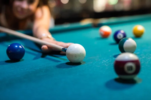 Happy caucasian woman wear casual cloth playing a game of billiards, lifestyle