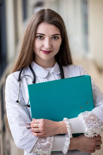 Beautiful Student Medical Gown Books Her Hands Standing Corridor Hospital — Zdjęcie stockowe