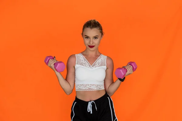 Sporty Young Woman Working Out Dumbbells Isolated Plain Background Sporty — Stok fotoğraf