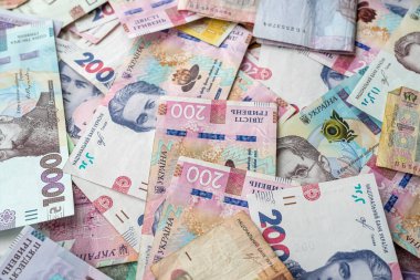 different UAH ukrainian money as background, finance concept, grivna