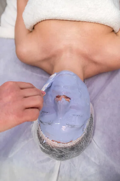 Close Dermatologist Applying Blue Refreshing Aging Mask Face Young Female — Stock fotografie