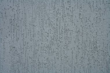 Kabuk böceği alçı dokusu. Sert, tırmalanmış bir yüzey. Kaotik desen, yivli yapı.