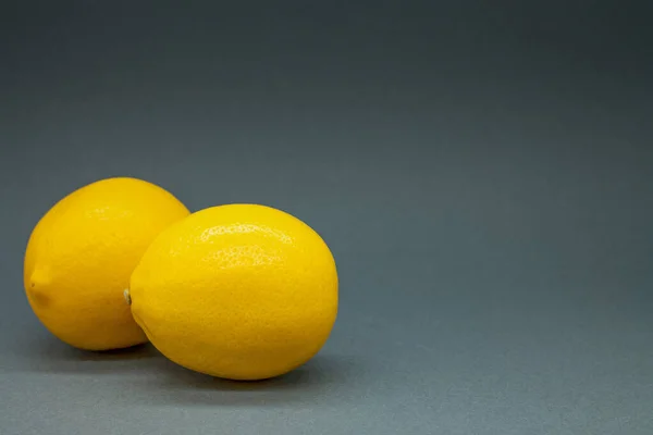 Two Lemons Gray Background Colors Year Space Text — Stock Photo, Image