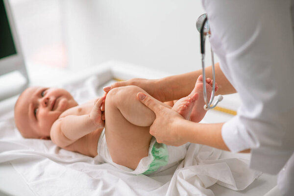 Newborn child undergoing a physical examination in a clinic