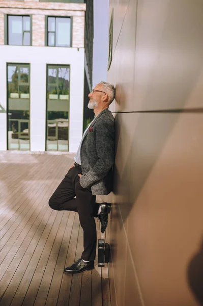 stock image Happy handsome mature male in eyeglasses daydreaming outside