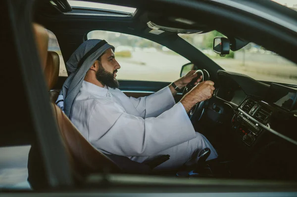 Saudi man driving a car and feeling good