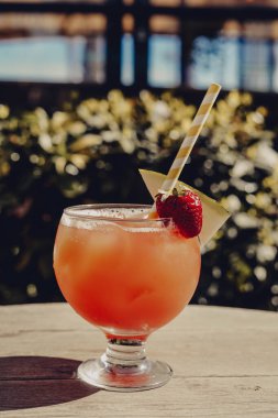 A sex on the beach cocktail made with vodka, orange juice and peach schnapps