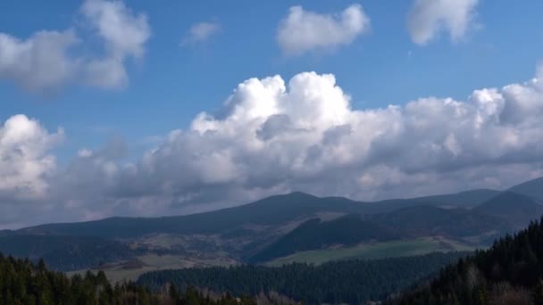 Clouds in motion over spring mountain landscape — Vídeos de Stock