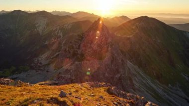 Sunset in the panorama of high mountain peaks, in a summer hight tatras landscape Zoom out . High quality 4k footage