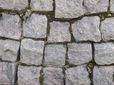 Kare taş levhalardan bir duvar. Şablon. Tarihsel özellik.