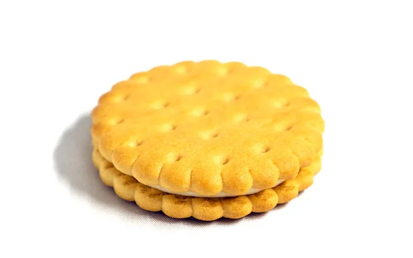 Sandwich cookies with creamy filling on a white background. Confectionery. — Photo