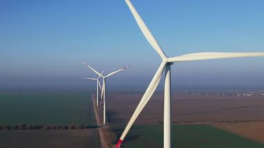 Wind machines with powerful propellers operate in field