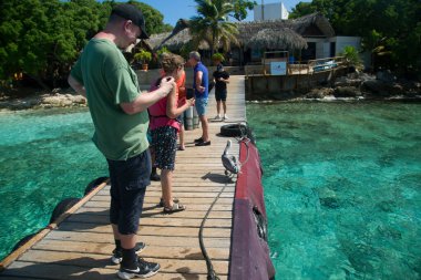 tourists on the wooden pier