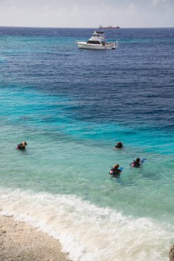 group of tourist snorkeling at open sea 