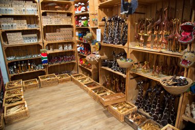 Interior of souvenir shop with assorted wooden figurines 