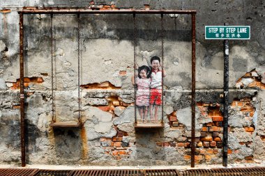 Georgetown, Penang, Malaysia - July 18, 2014: Mural street art by Louis Gan located in Georgetown, Penang Island, Malaysia. clipart
