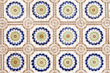 Antique ceramic Peranakan wall tile pattern on an old Sino-Portuguese shop house located in the UNESCO World Heritage site of Georgetown located on Penang Island, Penang State, Malaysia. clipart