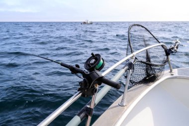 Fishing rod and reel holder on a sport fishing boat in Langara Island located in Haida Gwaii, British Columbia, Canada.
