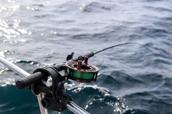 Fishing rod and reel holder on a sport fishing boat in Langara Island located in Haida Gwaii, British Columbia, Canada.