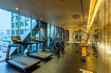 Bangkok, Thailand - January 23, 2017: Fitness center health club gym and exercise equipment in a luxury condominium Sindhorn Residence located in Bangkok, Thailand.