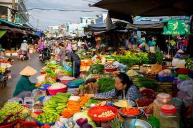 Duong Dong, Phu Quoc Island, Vietnam - January 25, 2018: Vietnamese market vendors selling fresh vegetables at the Duong Dong Market located in Duong Dong, Phu Quoc Island, Vietnam.