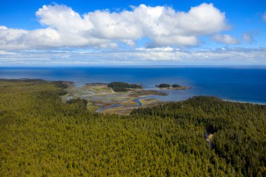 Aerial view from helicopter window over the ocean water in Haida Gwaii, British Columbia, Canada.