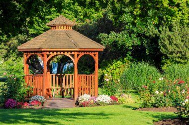 Cedar wooden gazebo at the rose garden in the city park of Penticton, British Columbia, Canada located in the Okanagan Valley.