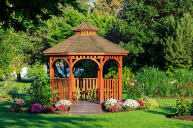 Cedar wooden gazebo at the rose garden in the city park of Penticton, British Columbia, Canada located in the Okanagan Valley.