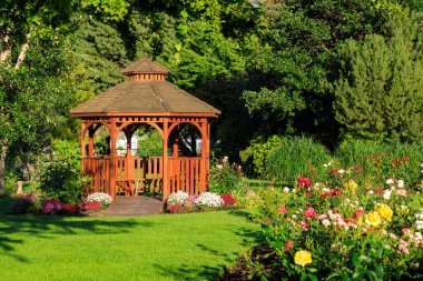 Cedar wooden gazebo at the rose garden in the city park of Penticton, British Columbia, Canada located in the Okanagan Valley.