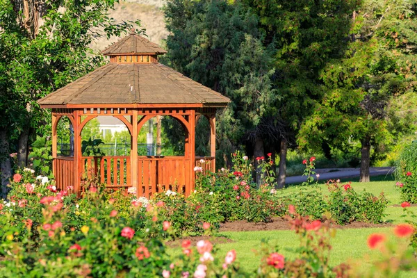 Cedar wooden gazebo at the rose garden in the city park of Penticton, British Columbia, Canada located in the Okanagan Valley.