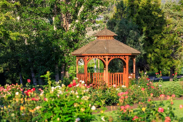 Cedar wooden gazebo at the rose garden in the city park of Penticton, British Columbia, Canada located in the Okanagan Valley.