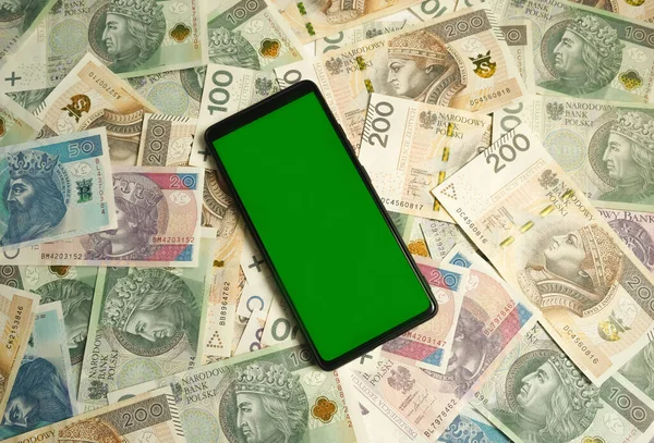 Green screen against the background of paper money. Place for text. High quality photo