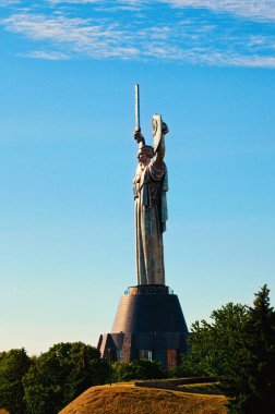 Kyiv, Ukraine-June 19,2022:Close-up view of famous Motherland Monument (Rodina Mother)against blue sky. Summer sunny morning.
