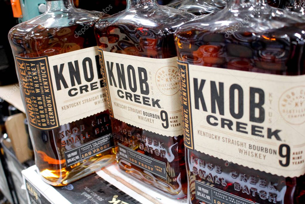Los Angeles, California, United States - 04-06-2021: A view of several bottles of Knob Creek bourbon whiskey 9 years, on display at a local big box grocery store.