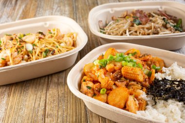 A view of several fast casual pan Asian rice and noodles bowls.