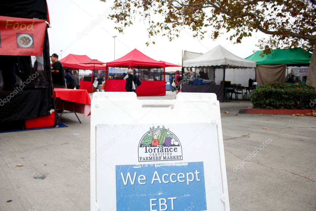 Los Angeles, California, United States - 10-25-2021: A view of an a-frame sign advertising the entrance to the Torrance Certified Farmers' Market.