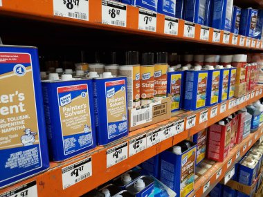 Los Angeles, California, United States - 07-15-2021: A view of several containers of Klean Strip painter's solvent and other paint removal products, on display at a local home improvement store. clipart