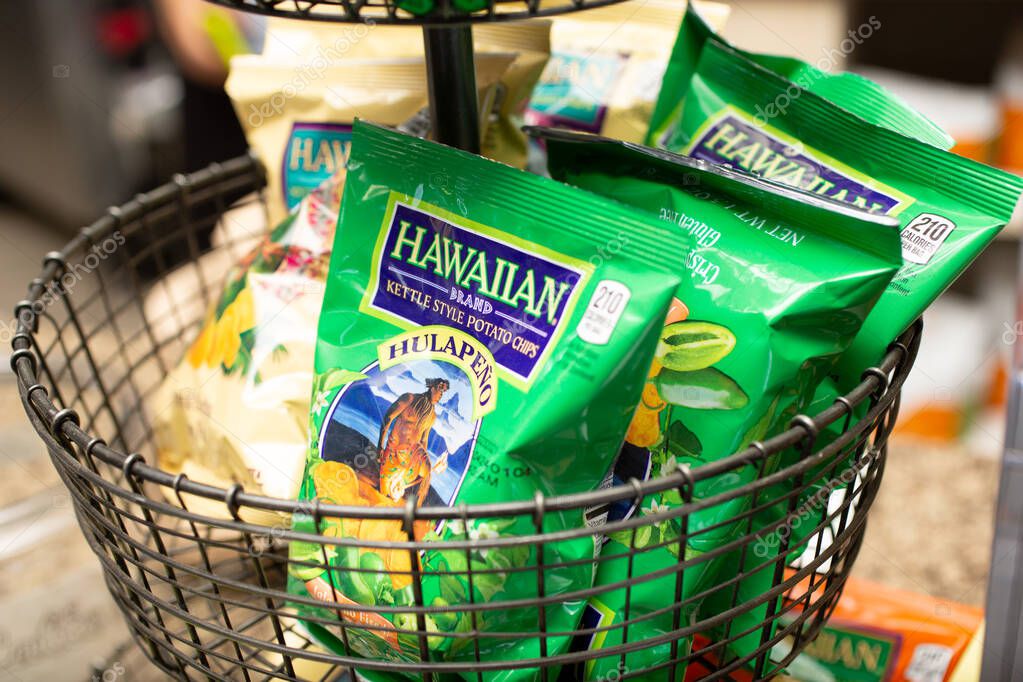 Los Angeles, California, United States - 10-02-2021: A view of several bags of Hawaiian Brand kettle style potato chips on a rack, in a local convenient store.