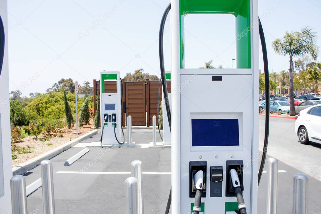 A view of an electric vehicle charging station located inside a commercial shopping center.