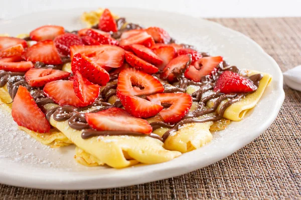 View Crepes Plate Topped Hazelnut Chocolate Spread Strawberry Slices — Stock Photo, Image
