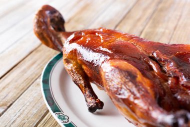 A view of a plate of roasted duck.