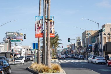Belmont Shore, California/United States - 02/12/2020: A view of traffic on the street, from the middle of the road, in downtown Belmont Shore, on 2nd Street.