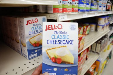 Long Beach, California/United States - 02/12/2020: A hand holds a box of Jell-O No Bake Classic Cheesecake, on display at a local grocery store.