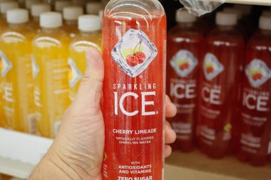Long Beach, California/United States - 02/12/2020: A hand holds a bottle of Sparkling Ice soda on display at a local grocery store.