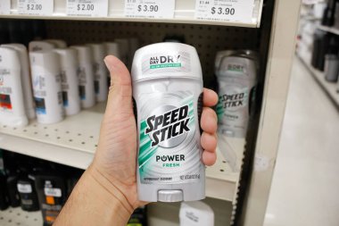 Long Beach, California/United States - 02/12/2020: A hand holds a stick of Speed Stick Power Fresh deodorant on display at a local department store.