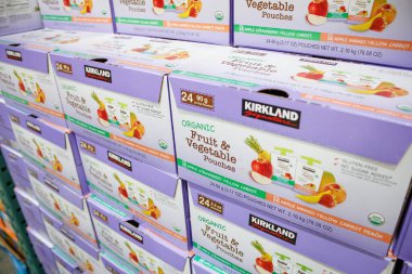 Alhambra, California/United States - 02/19/2020: A view of several cases of Kirkland Signature Organic Fruit & Vegetable Pouches, on display at a local Costco.